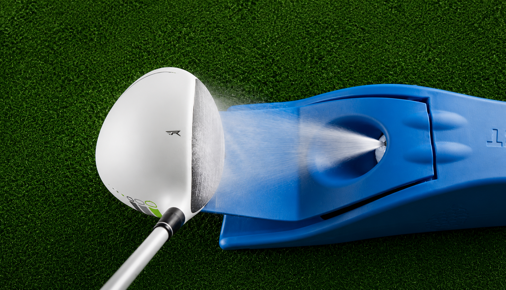Golf club head with a blue inkpact printer on a green background