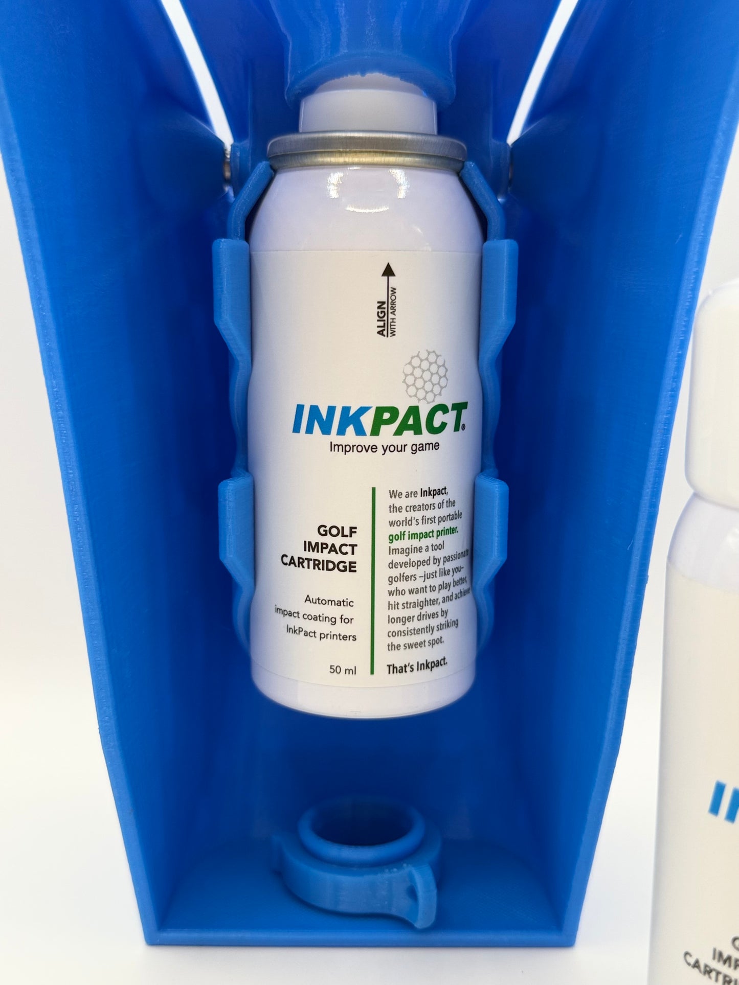 Inkpact golf impact cartridge in a blue holder on a white background