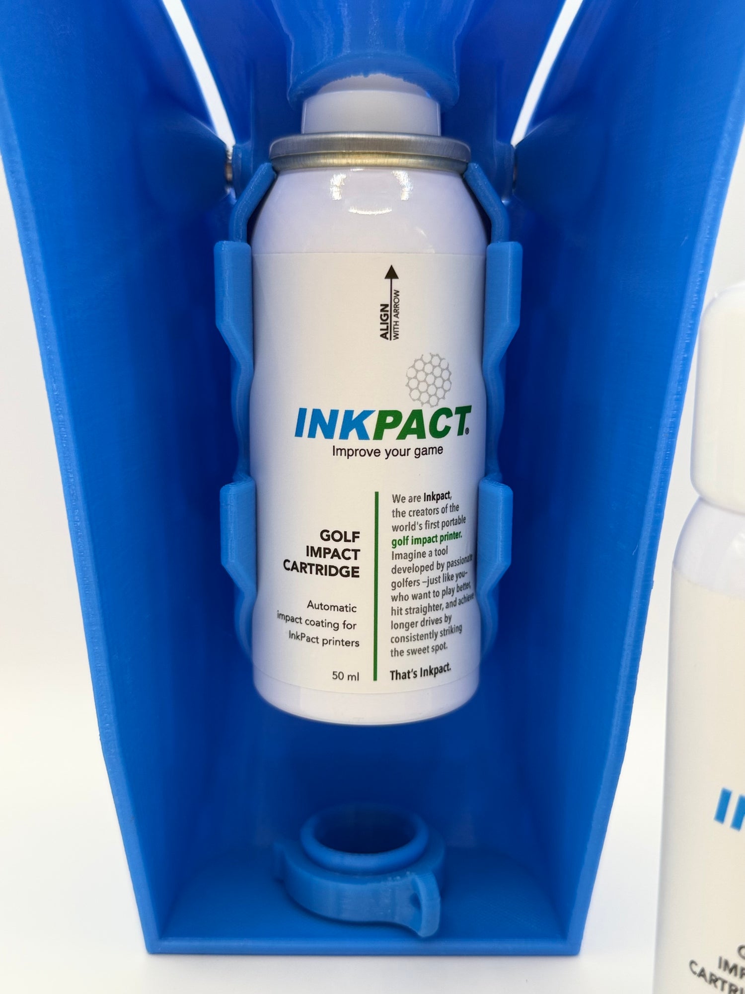 Inkpact golf impact cartridge in a blue holder on a white background