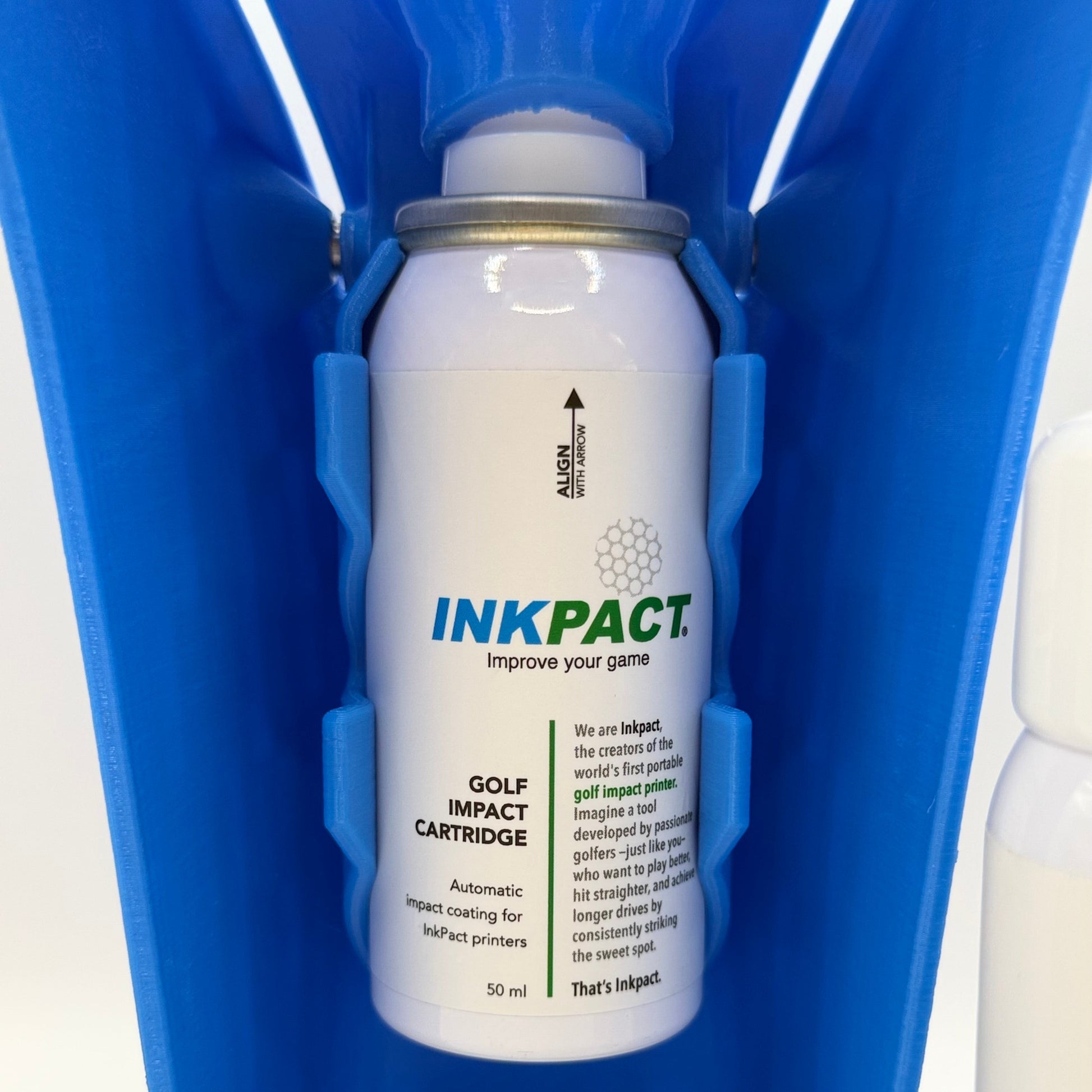 Inkpact golf impact cartridge in a blue Golf Impact Printer on a white background